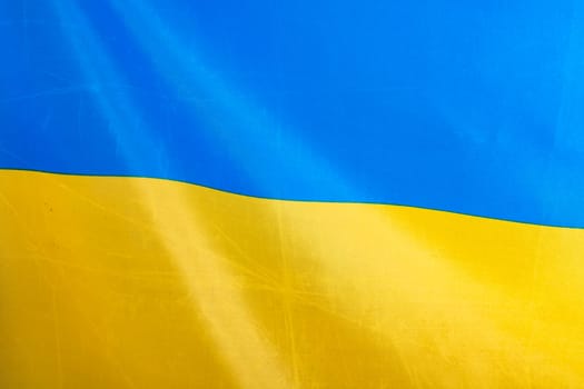 Flag of Ukraine, UA. Blue and yellow colors. Close up shot, background