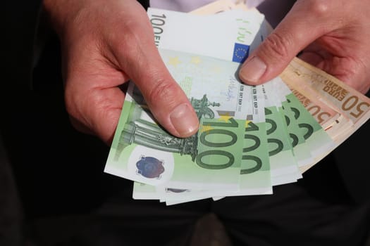 Businessman with Euro Banknotes