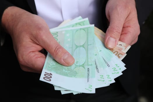 Businessman with Euro Banknotes