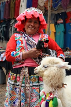 Woman with Alpaca at the Market of Pisac in Peru