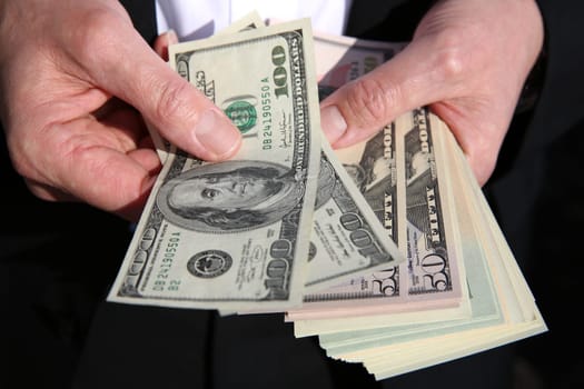 Businessman with US Dollar Banknotes