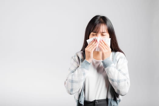 Unhappy woman bad mood her cry wipe mucus with tissue, beautiful young female stress feel sneezing sinus use towel to wipe snot from nose, studio shot isolated on white background with copy space