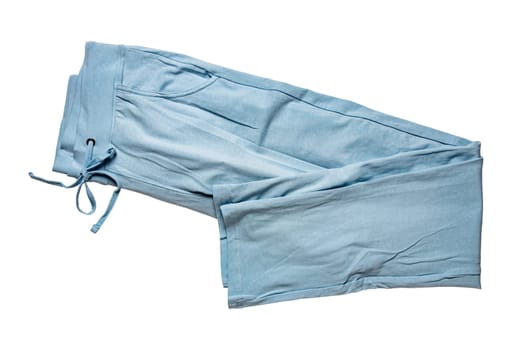 Sweat pants isolated. Close-up of womans fashionable blue casual trousers or jersey trousers isolated on a white background. Jogging outfit for workout. Clipping path.
