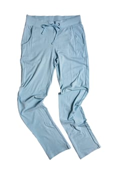 Sweat pants isolated. Close-up of womans fashionable blue casual trousers or jersey trousers isolated on a white background. Jogging outfit for workout. Clipping path.