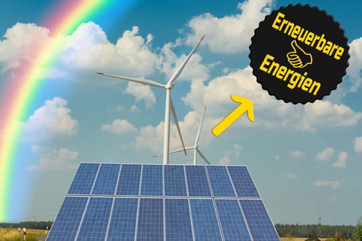 Sustainable green energy. Electric windmill generators in the sunrise..Sign with  Caption Renewable energy
