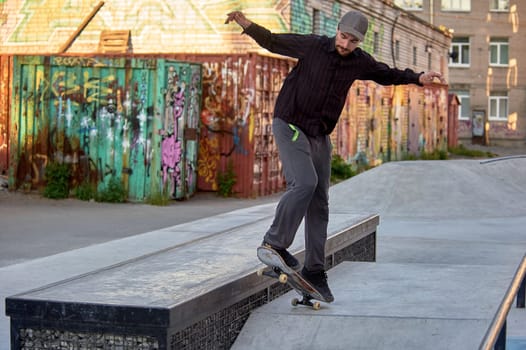 skateboarder prepares to jump on the parapet. High quality photo