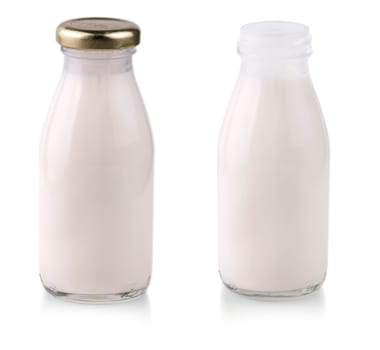 The glass bottle with milk with shadow isolated on white background