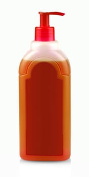The red bottle with shampoo with dispenser on white background