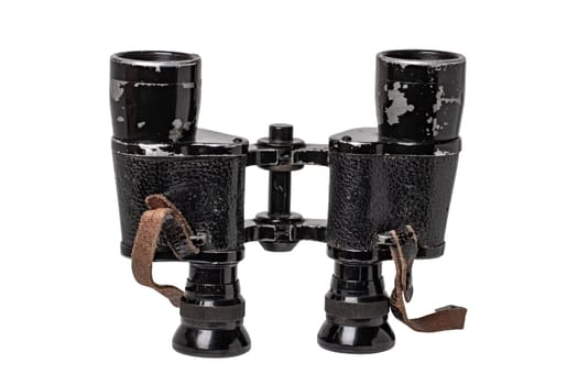 Vintage binoculars isolated. Close-up of an old german Binoculars with leather straps used from military during the second world war isolated on white. Macro.
