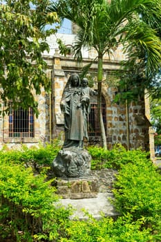 Statue in behind The Our Lady of Mount Carmel Cathedral, Puntarenas Cathedral is a temple of the Roman Catholic church in the city of Puntarenas, Costa Rica