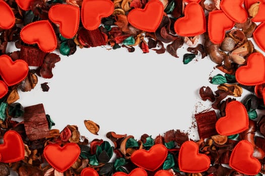 Different dry flowers with red hearts background. with copy space. Valentines day or love concept