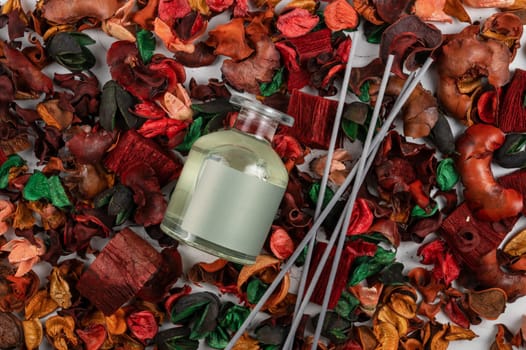 Home aroma fragrance diffuser on dry flowers background