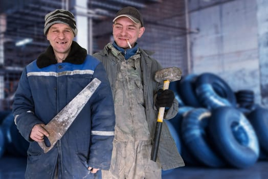 Two bad unskilled workers in bad dirty tattered uniform with bad tools. Concept of unskilled workers or crooks or poor quality workers