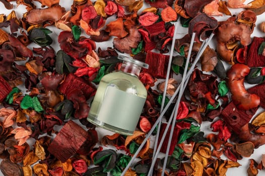 Home aroma fragrance diffuser on dry flowers background