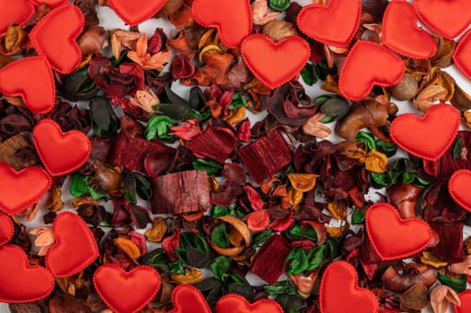 Different dry flowers with red hearts background. Valentines day or love concept