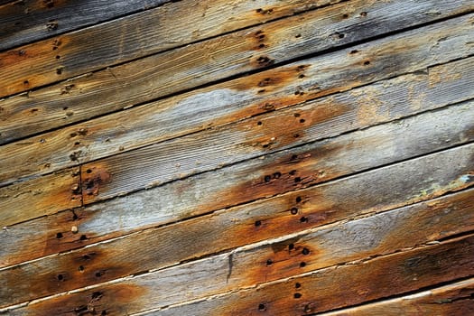 A closeup shot of an old rusty wooden surface