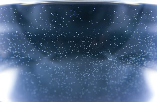 The blue background with small white sparkles