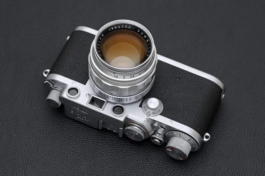 Kagawa, Japan - February 27, 2022: Leica ⅢF rangefinder camera with Leitz 50mm f1.4 Summilux L-mount lens. Vintage collectible classic lens concept.