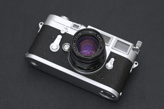 Kagawa, Japan - February 27, 2022: Leica M3 rangefinder camera with Leitz 50mm f2 Summicron M-mount lens. Vintage collectible classic lens concept.