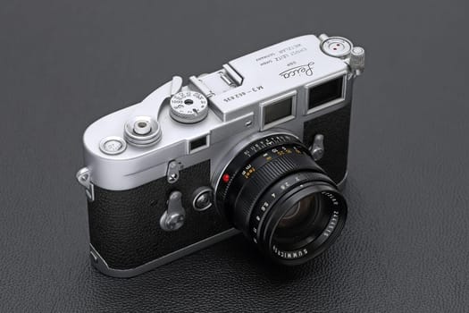 Kagawa, Japan - February 27, 2022: Leica M3 rangefinder camera with Leitz 50mm f2 Summicron M-mount lens. Vintage collectible classic lens concept.