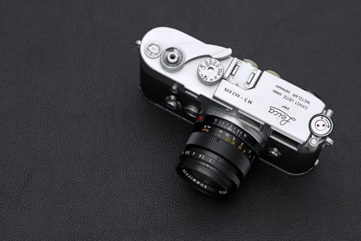 Kagawa, Japan - February 27, 2022: Leica M3 rangefinder camera with Leitz 50mm f2 Summicron M-mount lens. Vintage collectible classic lens concept.