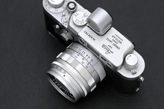 Kagawa, Japan - February 27, 2022: Leica ⅢG rangefinder camera with Leitz 50mm f1.4 Summilux L-mount lens. Vintage collectible classic lens concept.