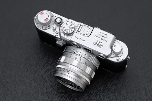 Kagawa, Japan - February 27, 2022: Leica ⅢF rangefinder camera with Leitz 50mm f1.4 Summilux L-mount lens. Vintage collectible classic lens concept.
