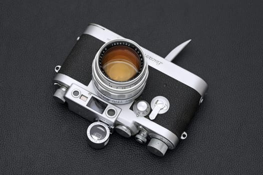 Kagawa, Japan - February 27, 2022: Leica ⅢG rangefinder camera with Leitz 50mm f1.4 Summilux L-mount lens. Vintage collectible classic lens concept.