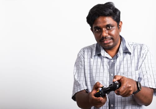 Asian happy portrait young black man funny use hand playing video game pad joystick controller, studio shot isolated on white background