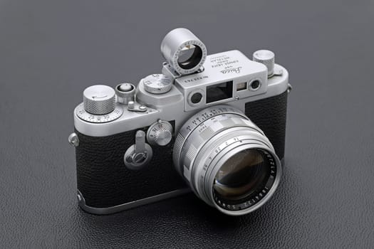 Kagawa, Japan - February 27, 2022: Leica ⅢG rangefinder camera with Leitz 50mm f1.4 Summilux L-mount lens. Vintage collectible classic lens concept.