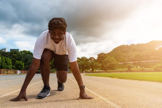 Asian young athlete sport runner black man wear feet shoe active ready to start running training at the outdoor on the treadmill for a step forward, healthy exercise workout, closeup face front