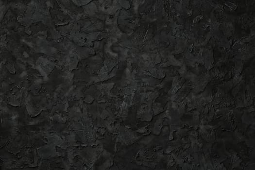 Black stucco texture. Black stone background. Copy space for text. Flat lay.