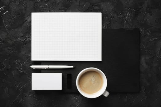 Blank corporate stationery set on black stone background. Branding mock up. Flat lay.