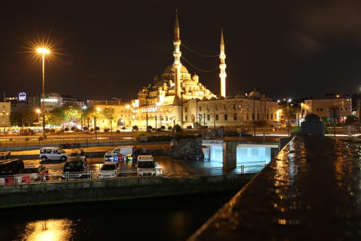 View from Galata Bridge to New Mosque called Yeni Cami Mosque in Istanbul by Night. Turkey