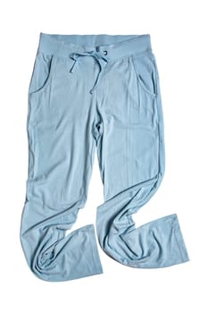 Sweat pants isolated. Close-up of womans fashionable blue casual trousers or jersey trousers isolated on a white background. Jogging outfit for workout. Clipping path.