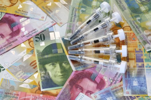 Swiss Francs Banknotes with Syringe