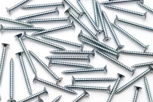 silver tapping screws isolated on white background
