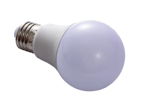 A white LED lamp with an E27 base lies on a white insulated background. High quality photo