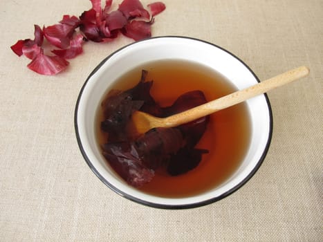 Dye agent, red decoction from red onion peel in a bowl
