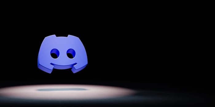 Discord Logo 3D Symbol Shape Spotlighted on Black Background with Copy Space 3D Illustration