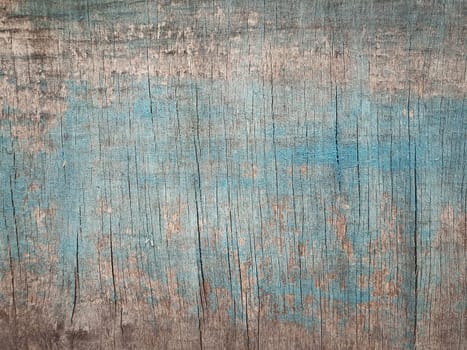 Old wooden texture with blue abstract paint. Grunge plank or plywood surface background