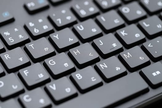 KAGAWA, JAPAN - MARCH 05, 2022 - Close up of computer keyboard. Alphabetics and Japanese hiragana typing keyboard.