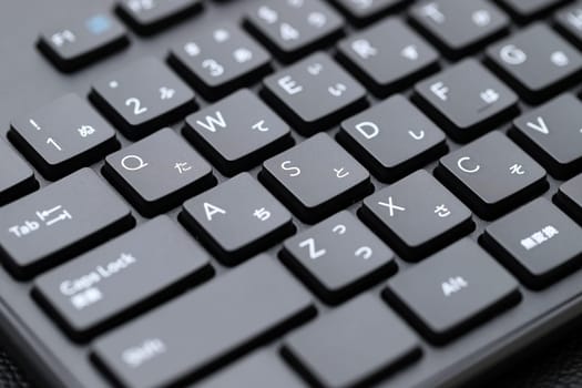 KAGAWA, JAPAN - MARCH 05, 2022 - Close up of computer keyboard. Alphabetics and Japanese hiragana typing keyboard.