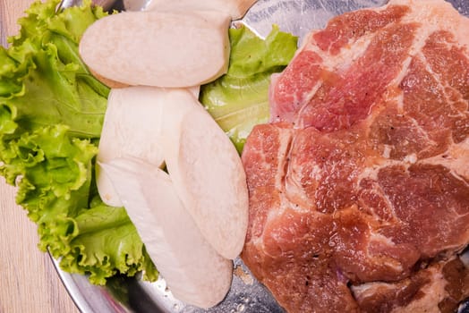 Raw pork on plate, Korean traditional style fresh pork beef belly BBQ, Japanese meat hot pot or Shabu in the restaurant, barbecue food