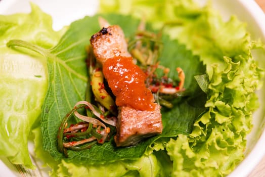 BBQ korean grill buffet. grilling meat wrap green vegetable leaf for eat at restaurant, korean barbeque style, Healthy food or Unhealthy food concept