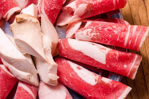 Raw pork on plate, Korean traditional style fresh pork beef belly BBQ, Japanese meat hot pot or Shabu in the restaurant, barbecue food