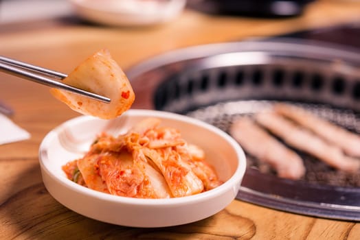 Spicy Kimchi group. Korean pickle or Pickled radish vegetables set and seasoning on bowl on stove serve wood table background, Japanese food