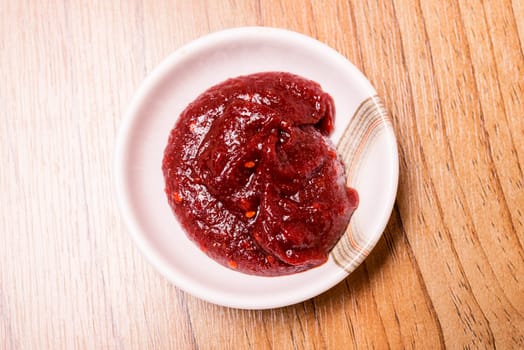Korean BBQ gochujang red chili sauce. for Beef grill on wood table , Japanese food style barbecue, Korean traditionl red pepper paste