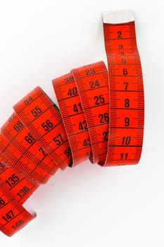 Top view of a red tailor meter, isolated on white background.