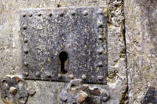 Iron lock on rusty door, construction and architecture